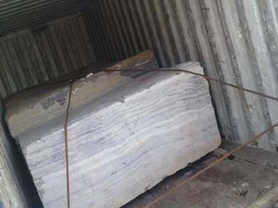 choco-brown-raw-indian-marble-block-cargo-container-tightly-stuffing-clamping-by-steel-rope-shipping-transport-safty-measures